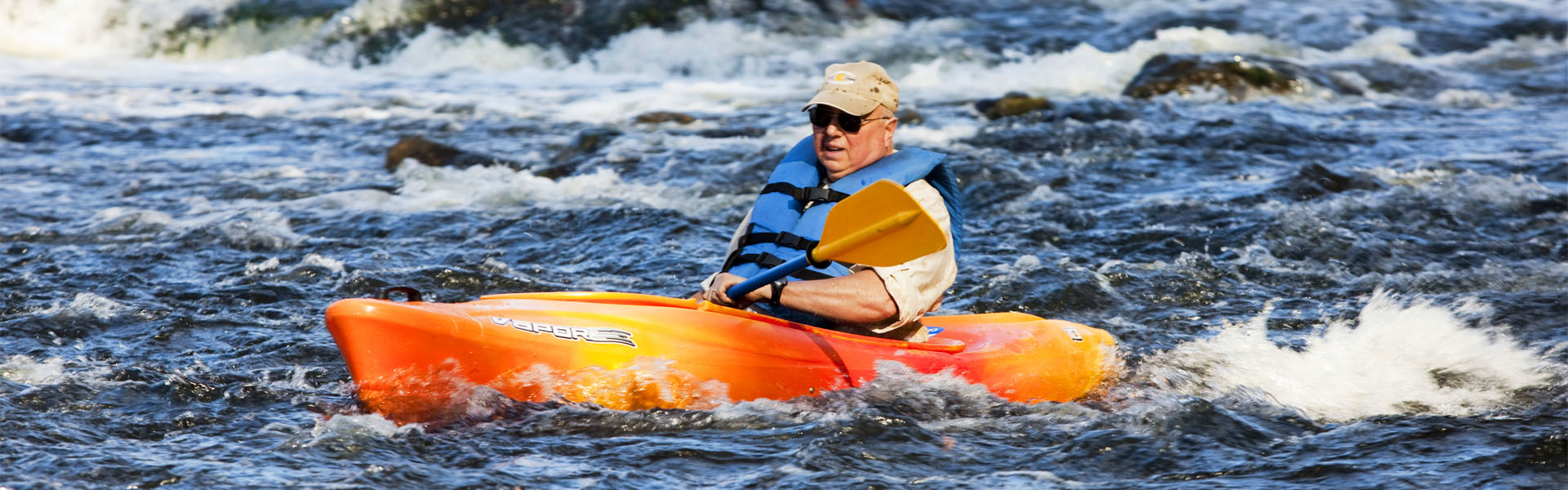 kayaking through rapids